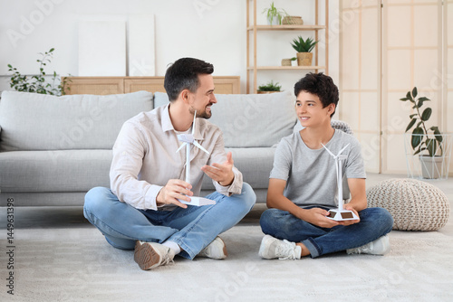 Teenage boy and his father ...