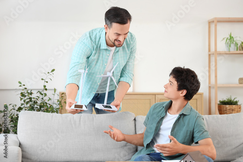 Father showing wind turbine...
