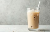 Refreshing protein Misutgaru drink. Korean beverage, iced milkshake with roasted multigrain powder, oat powder, rice, barley. Healthy drink for breakfast, lunch, energy boost. Glass with ice, straw