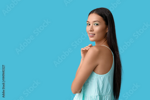 Happy young Asian woman wit...