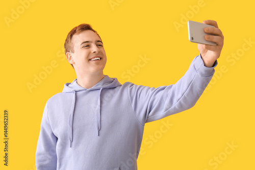 Young man with mobile phone...
