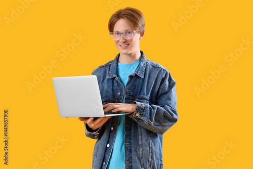 Male student using laptop o...