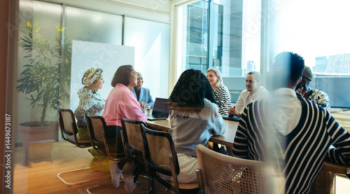 Photos Diverse team engaging in a collaborative business meeting in a modern conference