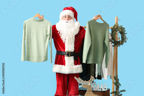 Santa Claus holding hangers...