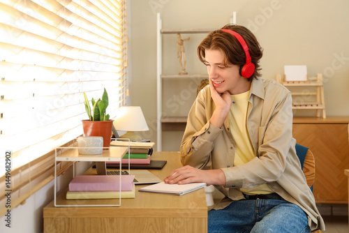 Male student with headphone...