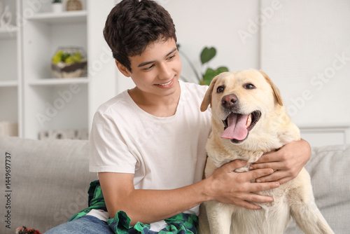 Happy teenage boy with cute...