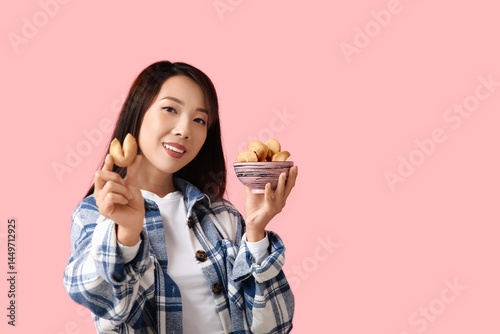 Young Asian woman with fort...