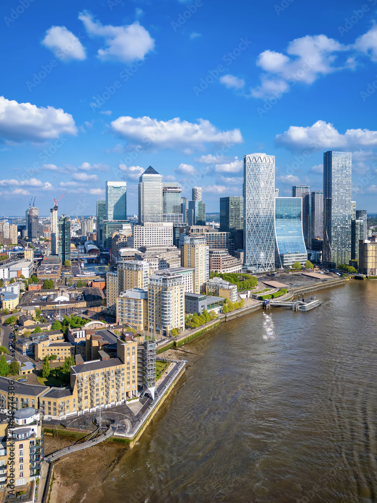Aerial view of the financial district Canary Wharf and the Docklands in London, England, during a sunny day