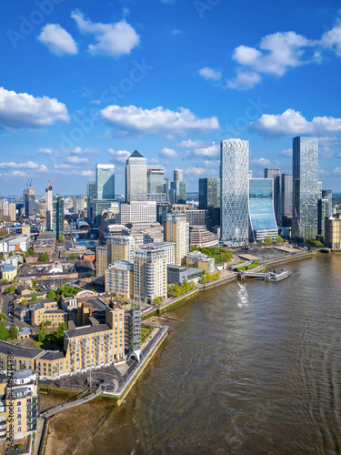 Aerial view of the financial district Canary Wharf and the Docklands in London, England, during a sunny day