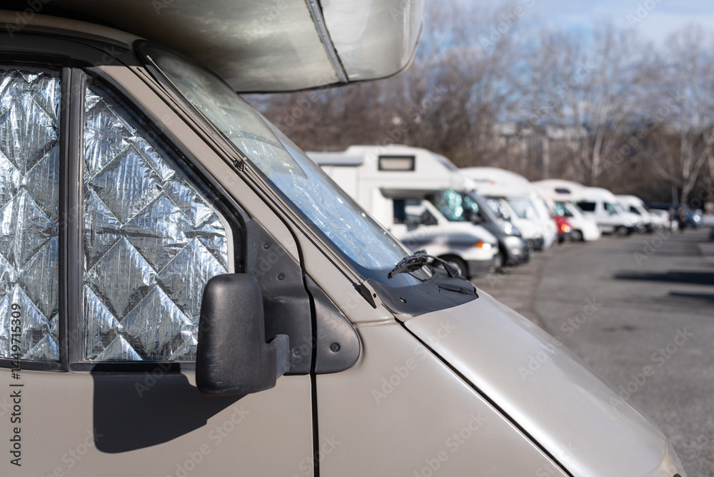 Obraz premium Motorhomes parked in a city parking lot