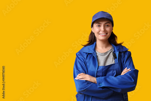 Young female mechanic on ye...