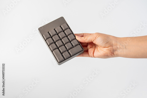 Bourne key contact numbers in hand on a white background.