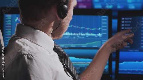 Wallpaper Mural Trader works in office using workstation and analysis technology. Workplace of professional crypto exchange broker. Close-up portrait. Global financial markets, business strategy, currency exchange Torontodigital.ca