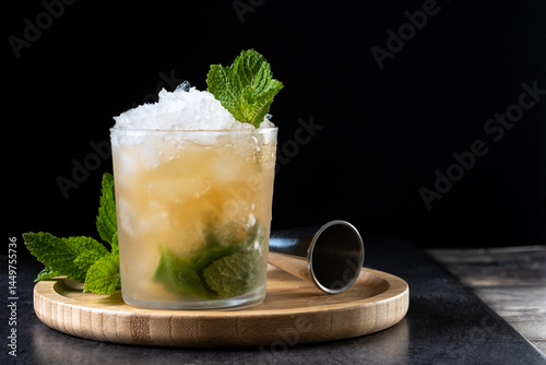 Fotografija Classic Mint Julep Cocktail on black background. Copy space