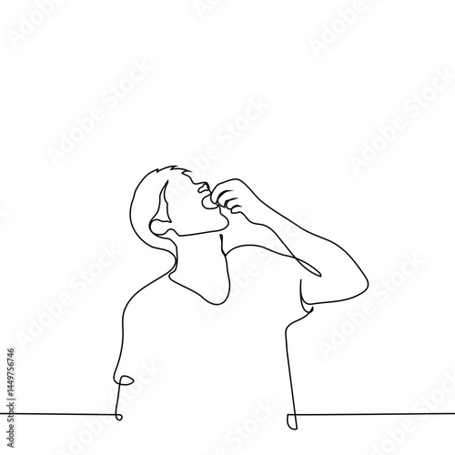 man with mouth open and face up puts or pours something small into his mouth - one line art vector taking pills