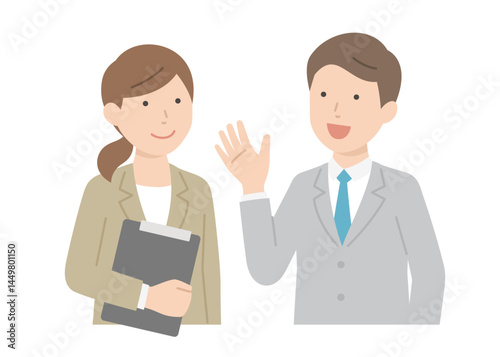 会話するスーツの男女