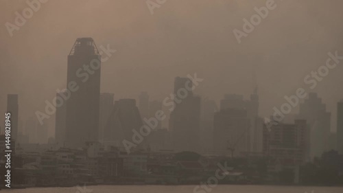 Cityscape of Bangkok covered by mixture of dust in air pollution. Heavy air pollution of fine particulate matter (PM2.5) in morning.	