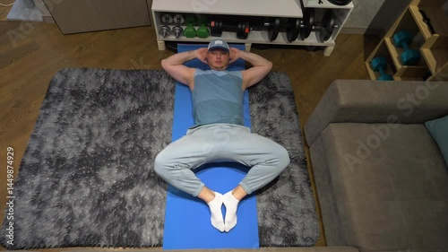  Exercise for the prostate and male potency Kegel. Male Pilates or yoga in the apartment. Workout on a fitness mat at home in the room. Warm-up warming up muscles. Slow motion