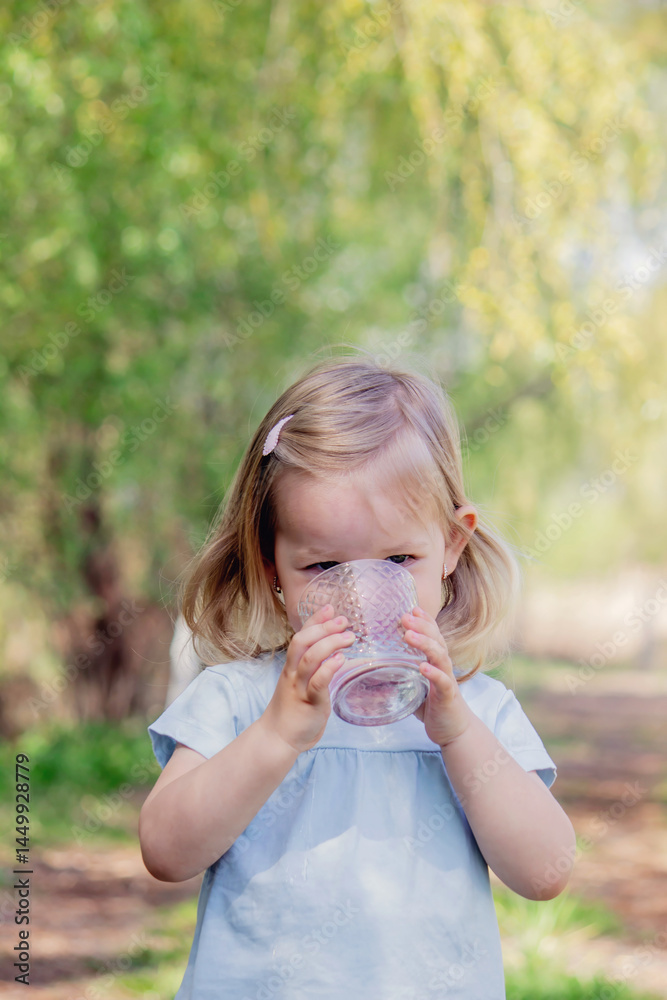 little girl drinking water from a glass little girl drinking water from a glass