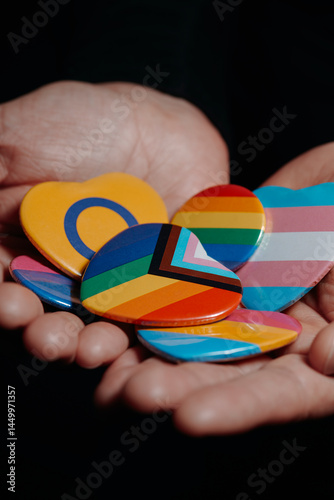 Obraz na płótnie badges with different LGBTQ flags in his hands w salonie