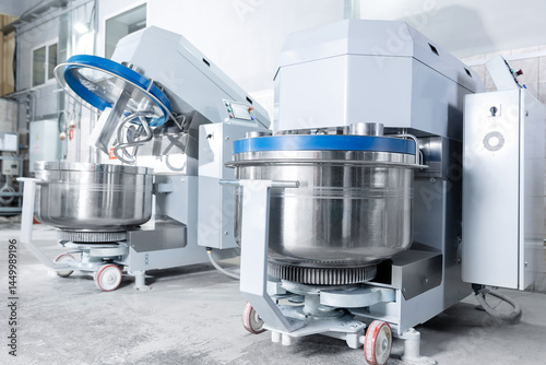 Industrial dough mixing machines in confectionery production facility