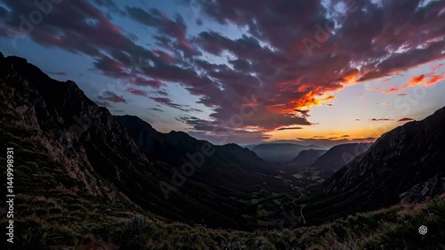 Fiery Sunset Over Dramatic Valley Landscape at Dusk