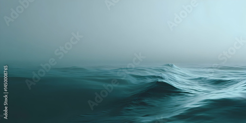 Endless tranquility enveloping calm ocean waves at dawn under a soft misty horizon