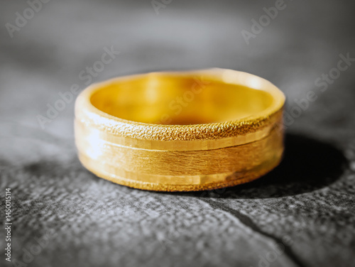 gold ring, gold price, gold jewelry, close up of gold ring on grey background