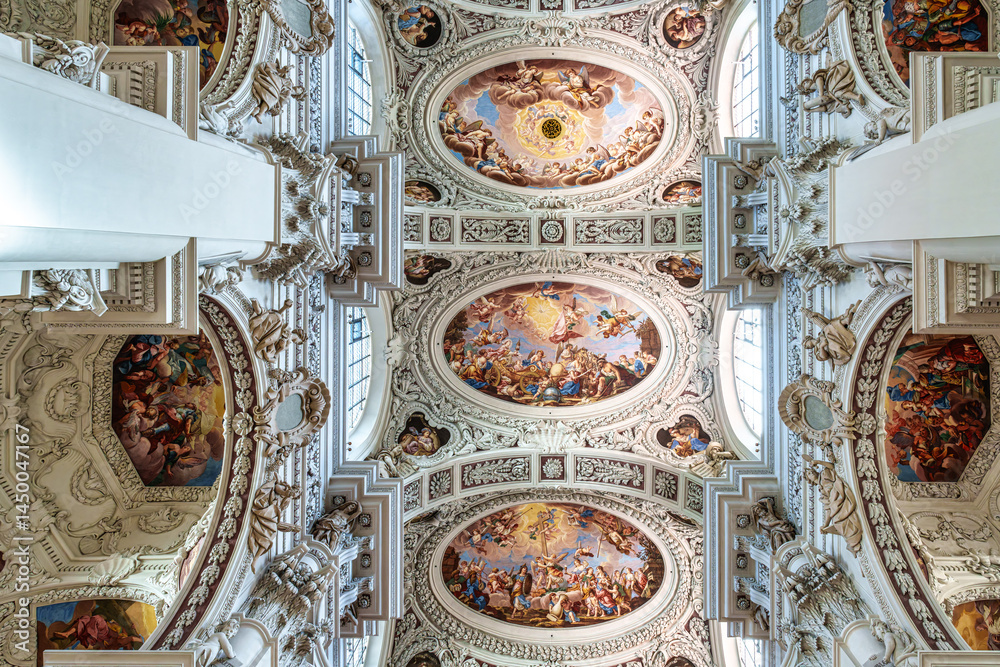 Interior of St. Stephans cathedral in Passau, Germany is an old white church with famous organ pipes