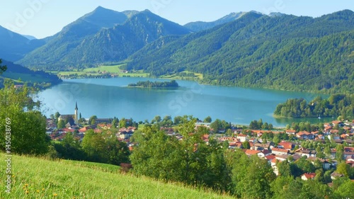 Idyllic lakeside scene at Schliersee with blue skies, summer reflections and a serene mountain backdrop in Bavaria