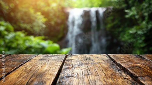 Wood table with a waterfall and lush green backdrop
