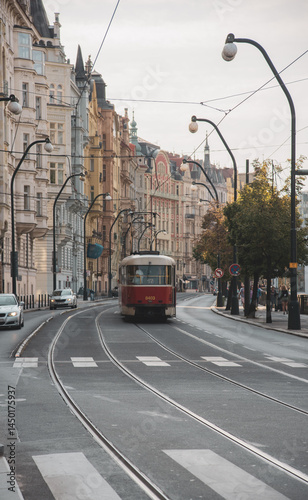 Old red trams on the historic streets of Prague