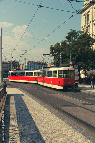 Old red trams on the historic streets of Prague