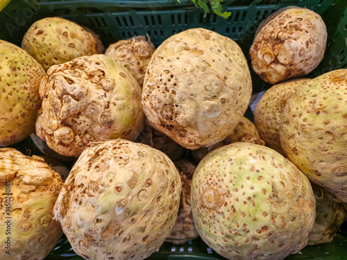 Fresh celeriac roots stacked in crate