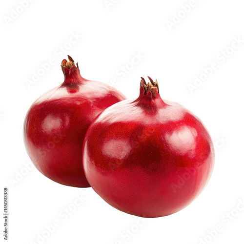 Two vibrant red pomegranates, glossy and plump, resting side-by-side against a black background.  Their round shapes and deep crimson hue suggest freshness and juiciness photo