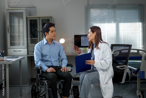 Female doctor discussing diagnosis with a patient in a wheelchair, fostering communication and understanding in a hospital room setting photo