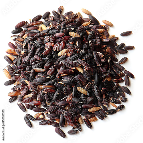A small pile of dark purple and brown rice grains scattered on a white surface casting a soft shadow.