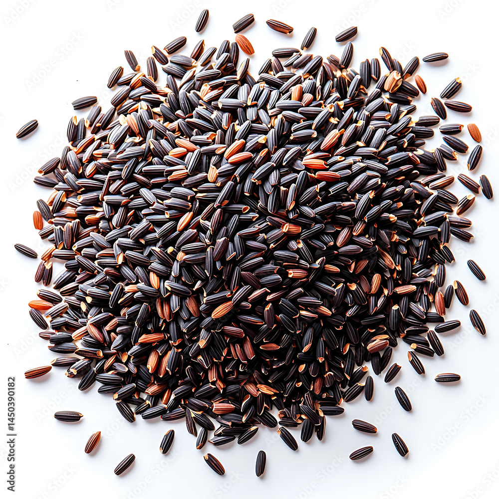A pile of uncooked black rice grains displaying a rich dark color with hints of reddish-brown scattered on a white surface.