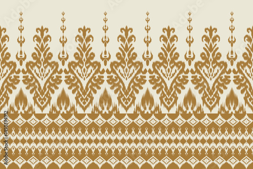 Traditional seamless golden ikat fabric pattern with ethnic ornamental border. Tribal boho style abstract geometric pattern. Vintage background for fabric, clothing and wallpaper.