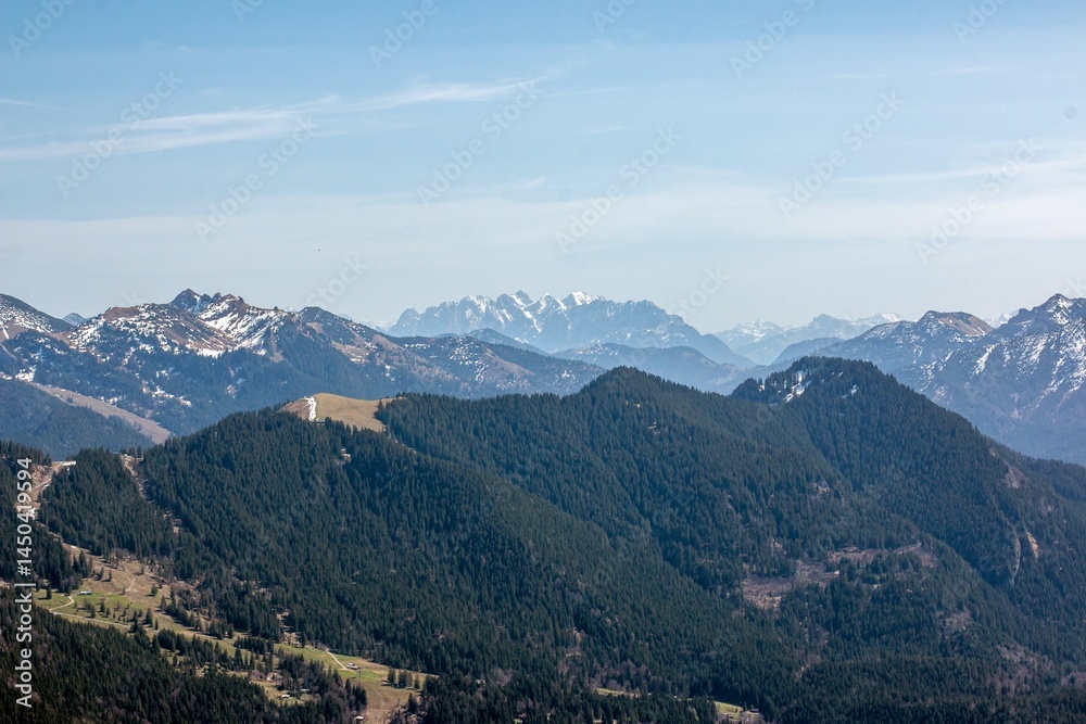 Naklejka premium View of the Alpine foothills from Wallberg Mountain Mountains on the horizon in the morning mist. Mountain range on the horizon in the morning mist. 
