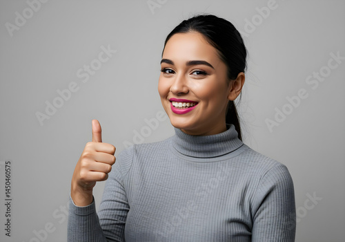 happy young woman indicating direction with pointing gesture 