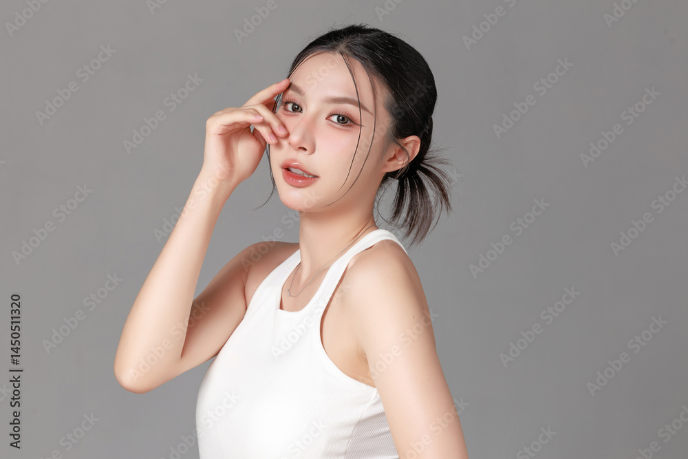Young Woman Posing Gracefully with Style and Elegance in Studio Young Woman Posing Gracefully with Style and Elegance in Studio