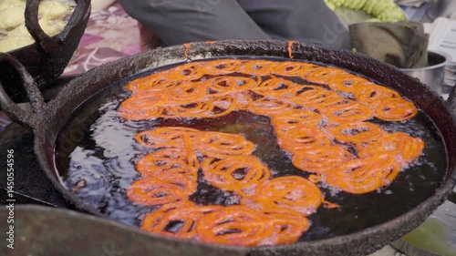 Jalebi sweets in oil pan, Indian cuisine and food culture  