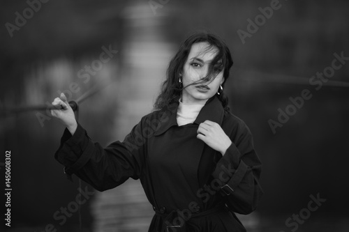 Obraz na płótnie beautiful brunette european girl in blue trench coat at nature. Young lady with beautiful face and lips. w salonie