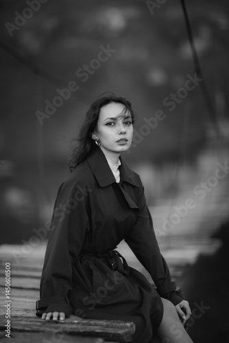 Obraz na płótnie beautiful brunette european girl in blue trench coat at nature. Young lady with beautiful face and lips. w salonie