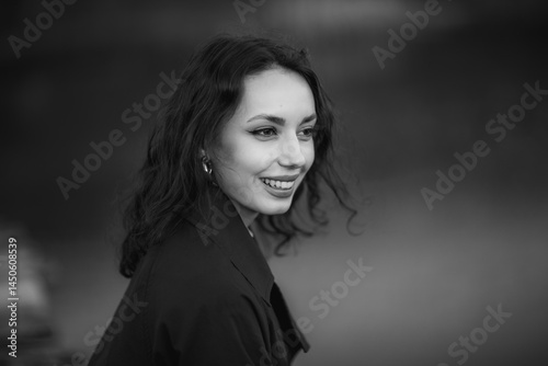 Obraz na płótnie beautiful brunette european girl in blue trench coat at nature. Young lady with beautiful face and lips. w salonie