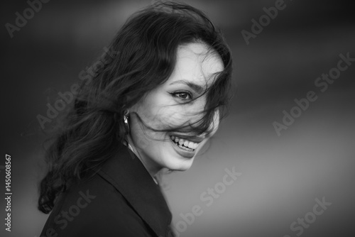 Obraz na płótnie beautiful brunette european girl in blue trench coat at nature. Young lady with beautiful face and lips. w salonie