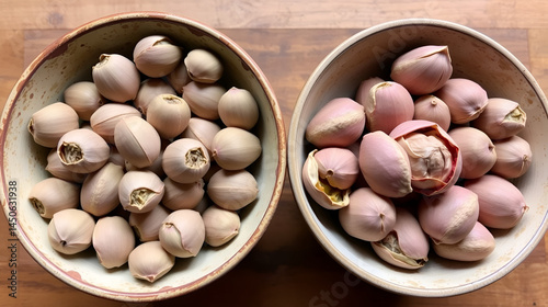Lotus seeds in bowl, shelled and unshelled, side by side