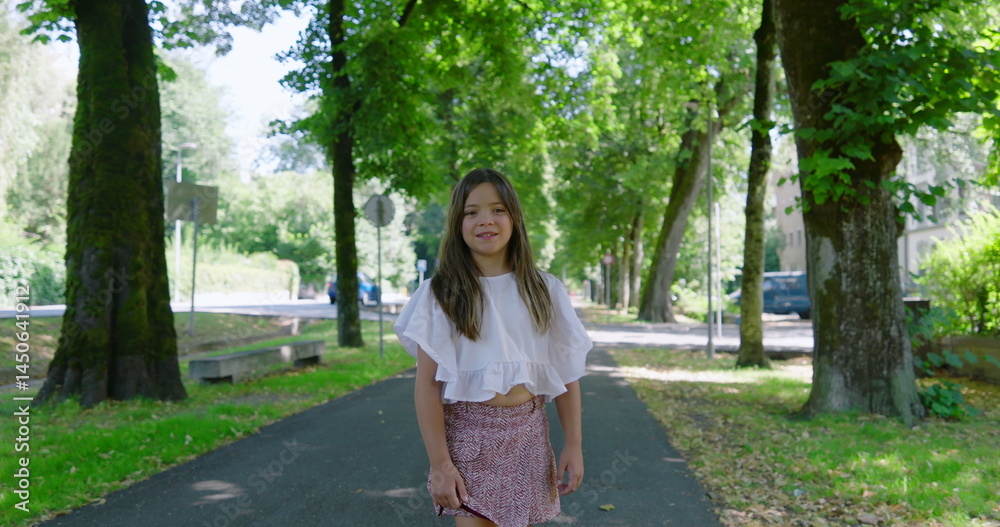 Smiling girl with long hair enjoying a sunny day in a green park, wearing a white blouse, surrounded by lush trees and foliage, standing on a shaded path with a soft smile Smiling girl with long hair enjoying a sunny day in a green park, wearing a white blouse, surrounded by lush trees and foliage, standing on a shaded path with a soft smile