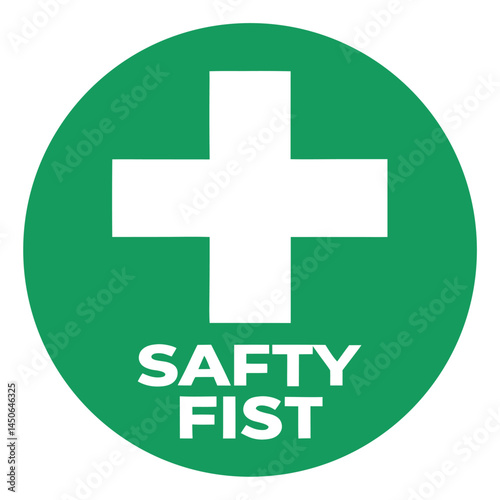 Green circular safety sign, white cross symbol, bold white text "SAFTY FIST", medical emergency icon, workplace safety, first aid emblem, high contrast graphic design, minimalist illustration,